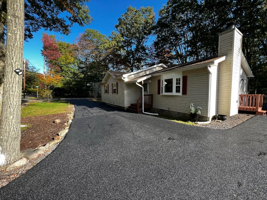 Freshly paved residential asphalt driveway